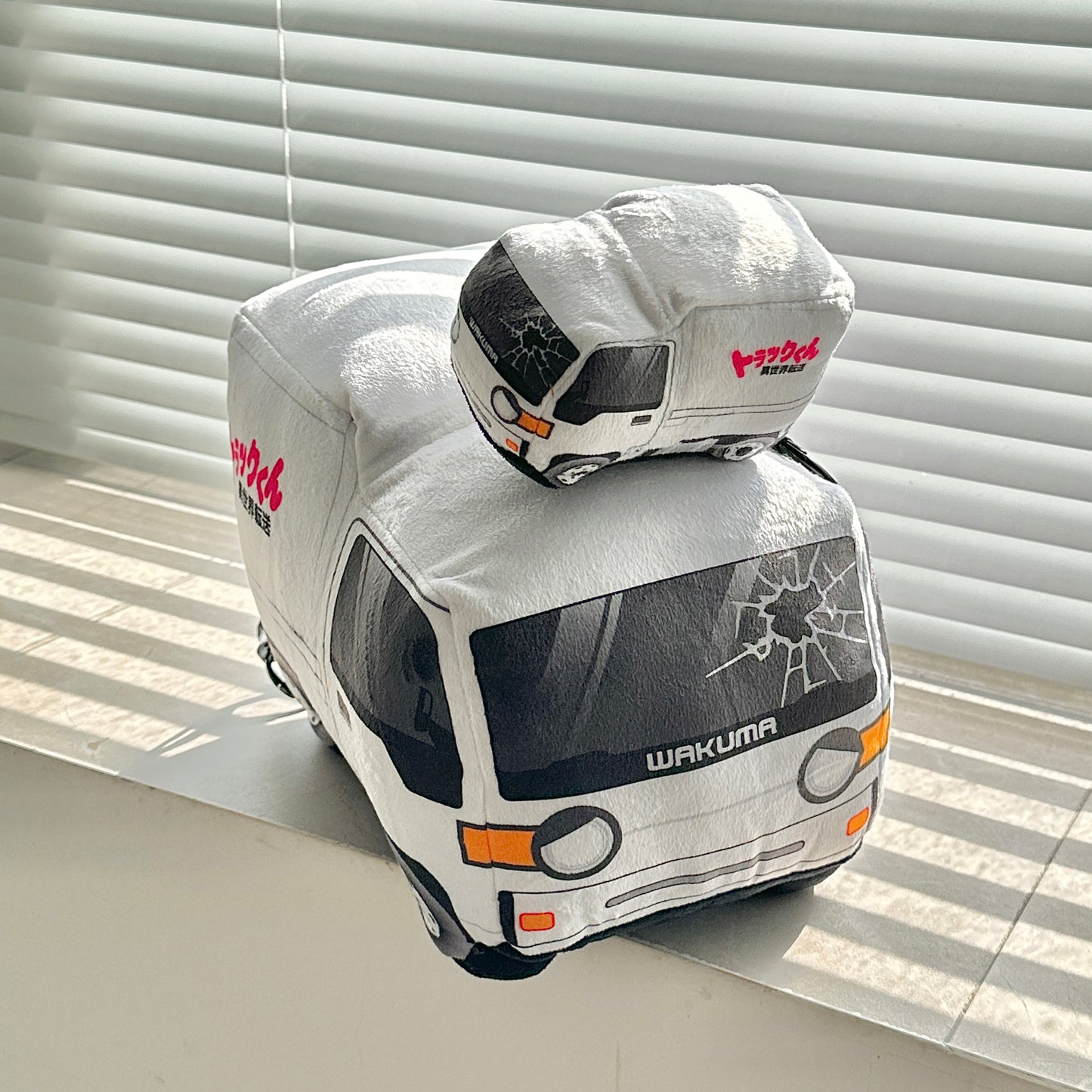 Truck-kun plushie by Wakuma – anime-inspired truck-shaped isekai plush, soft premium fabric, available in 30cm and 15cm sizes.