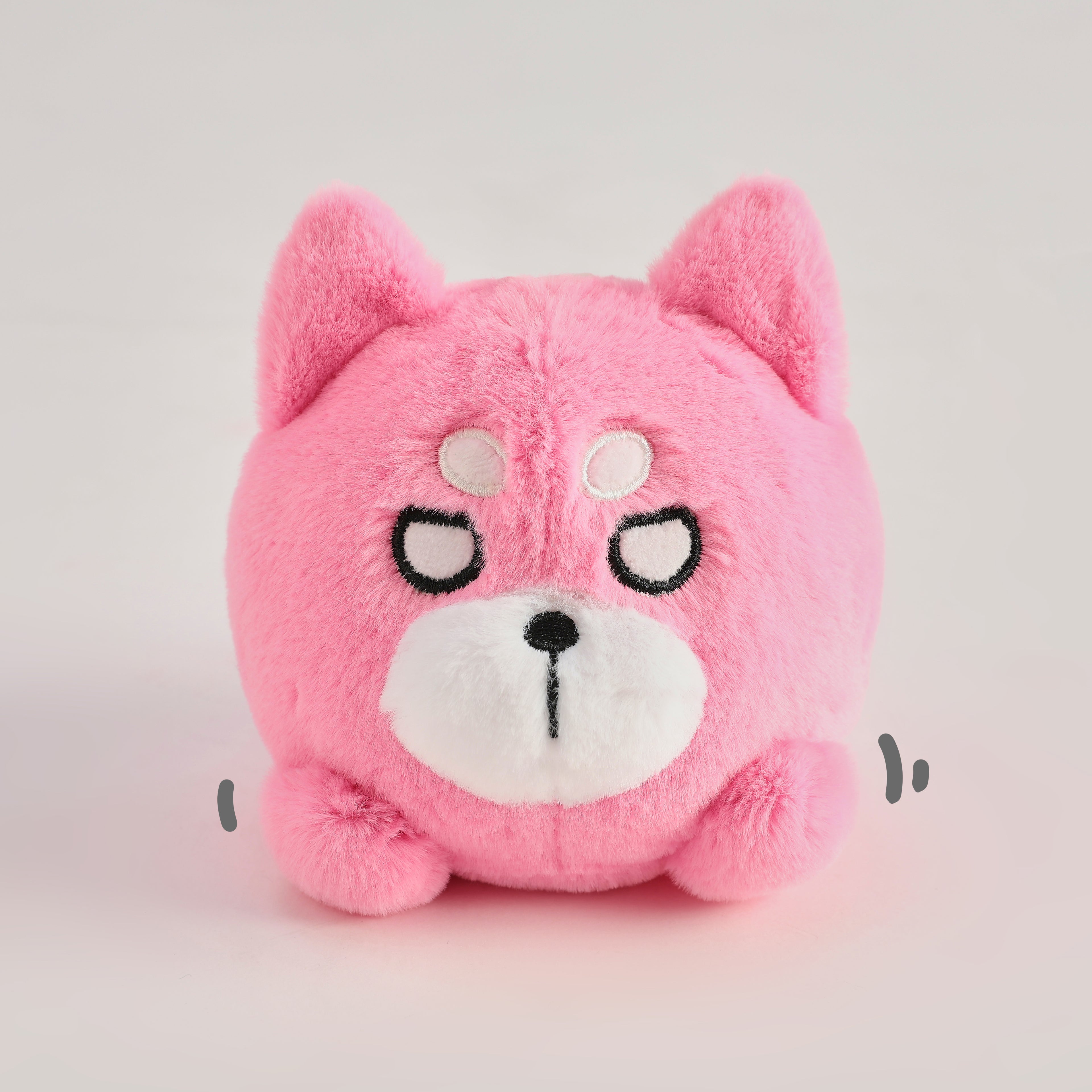 Pink round Wakuma bear plush keychain with chibi-style face, two forehead marks, and small paws.